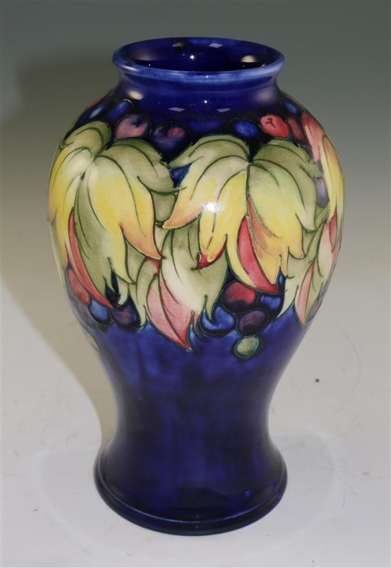 A Moorcroft leaf and berry pattern baluster vase, mid 20th century, 23.5cm (9.25in.)